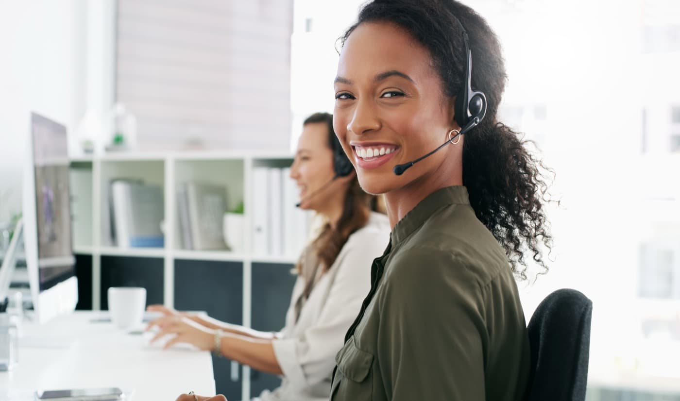 Friendly CashBox support agent on a headset
